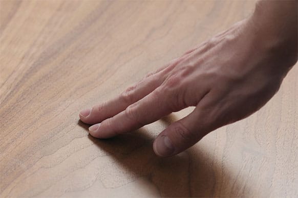 Akzonobel hand checking wooden surface